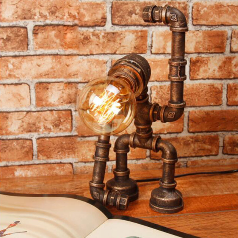 Lámpara de mesa de robot industrial Heracles Luz de hierro de una sola bombilla en bronce para dormitorio