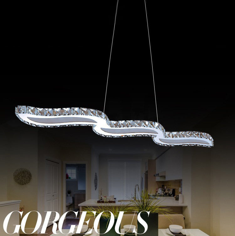 Moderno lussuoso lussuoso isola a pendente illuminazione ondata prismatica a soffitto di cristallo ottico per soggiorno