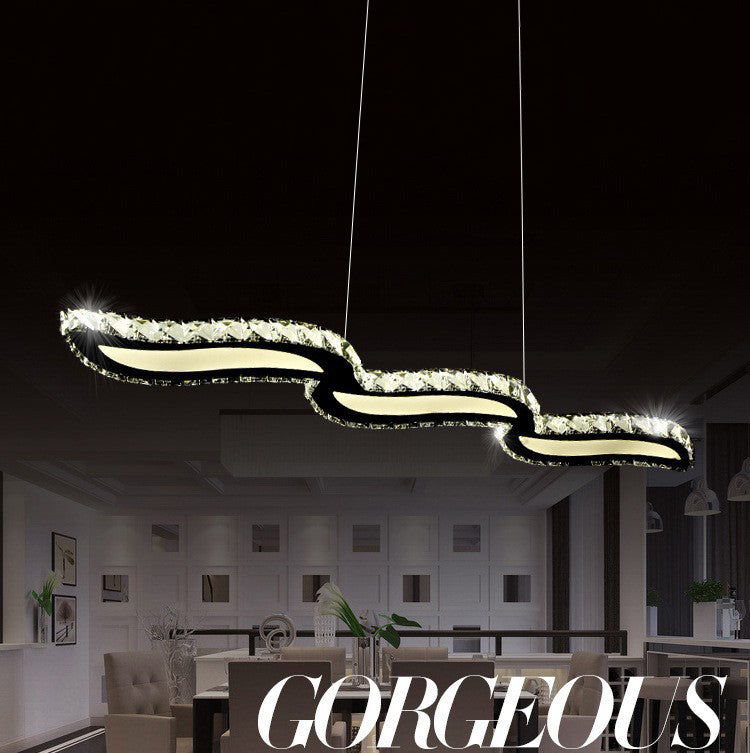 Moderno lussuoso lussuoso isola a pendente illuminazione ondata prismatica a soffitto di cristallo ottico per soggiorno