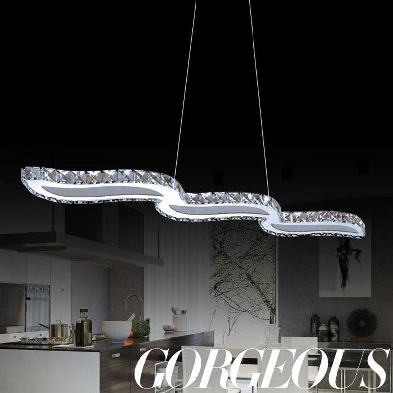 Moderno lussuoso lussuoso isola a pendente illuminazione ondata prismatica a soffitto di cristallo ottico per soggiorno