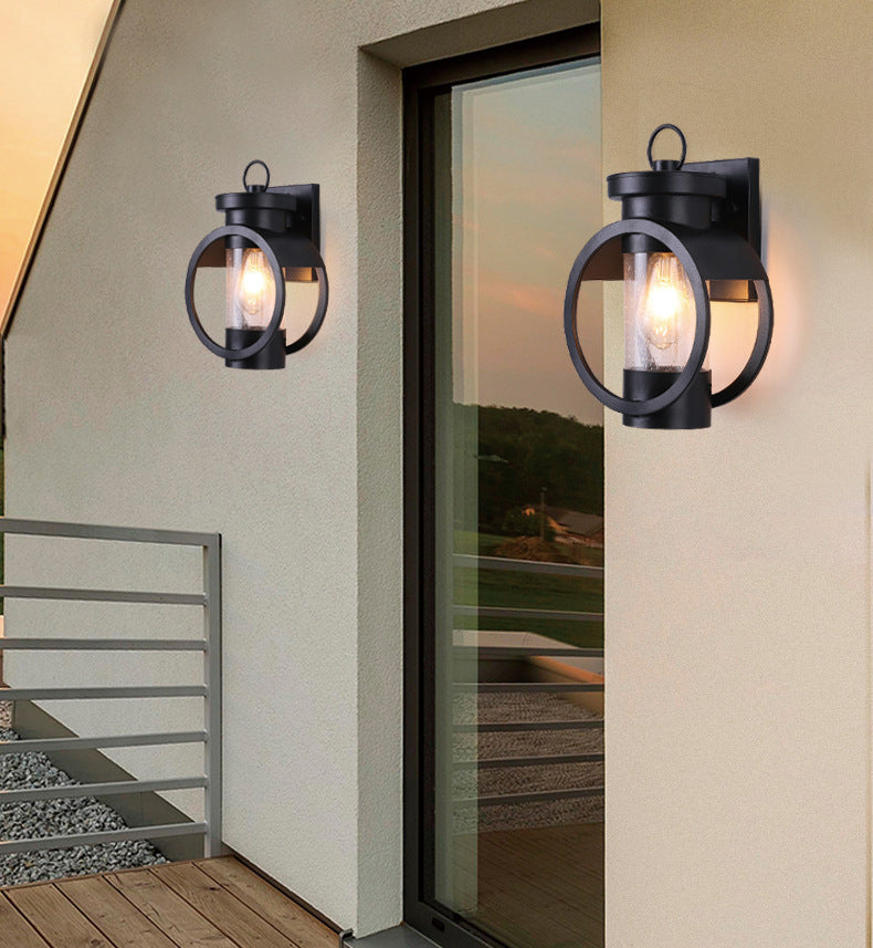 Industrial Style Black Wrought Iron Wall Sconce with Seeded Glass Cylinder Shade Single Bulb Outdoor Lighting Fixture
