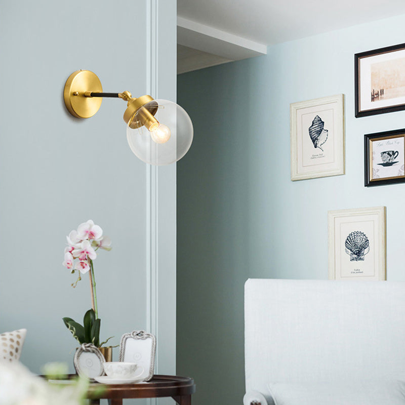 Adjustable Globe Sconce Light Simplicity 1 Bulb Brass Wall Mount Lamp with Transparent Glass Shade