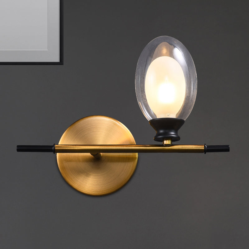 Clear/Amber Glass Egg Shape Wall Light Fixture Minimalist 1 Light Brass Sconce with Horizontal Arm