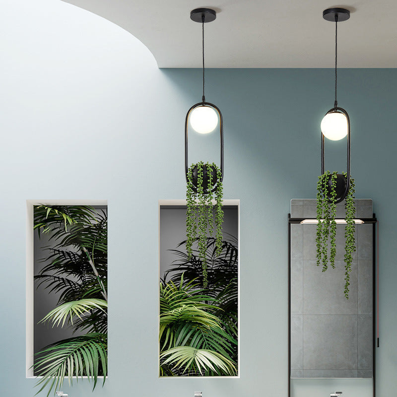 Black 1 Light Spherical Pendant Light Nordic Retro Oval Metal Ring Shade Hanging Lamp with Green Plant