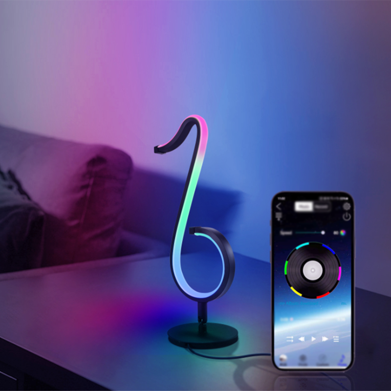 Lampada da tavolo a forma di nota musicale in metallo. Luce notturna a LED nera minimalista alla moda per camera da letto
