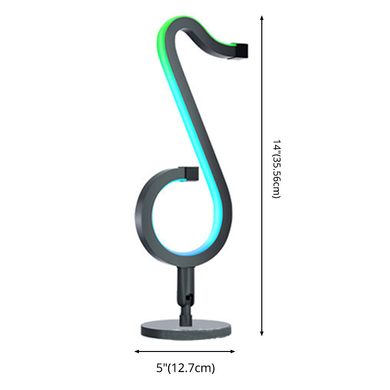 Lampada da tavolo a forma di nota musicale in metallo. Luce notturna a LED nera minimalista alla moda per camera da letto
