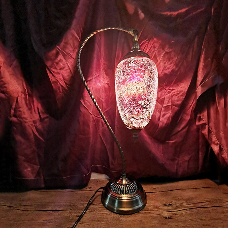 Lámpara de mesa de luz única, luz de vidrio elíptico de vidrio elíptico en bronce con brazo curvo