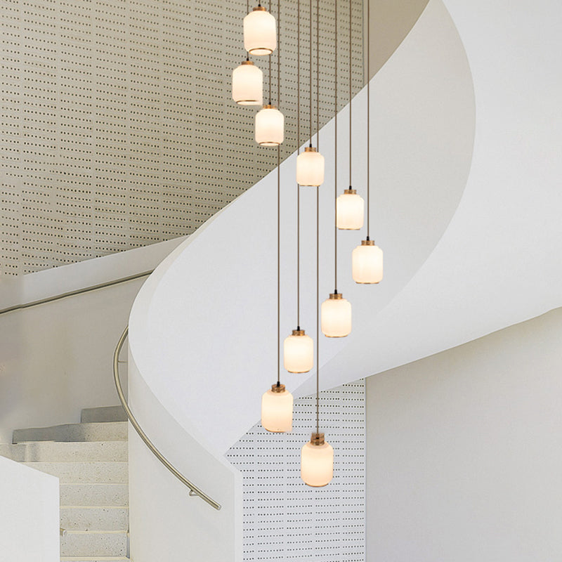 Weiße Glaszylindrische multi-Licht-Anhänger zeitgenössische Messingdecke für Treppen