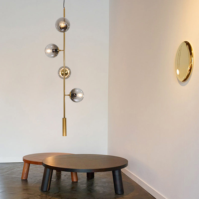 Modernistische bol hanglampverlichting grijs glas 4 lampen woonkamer plafond kroonluchter in goud met potloodarm