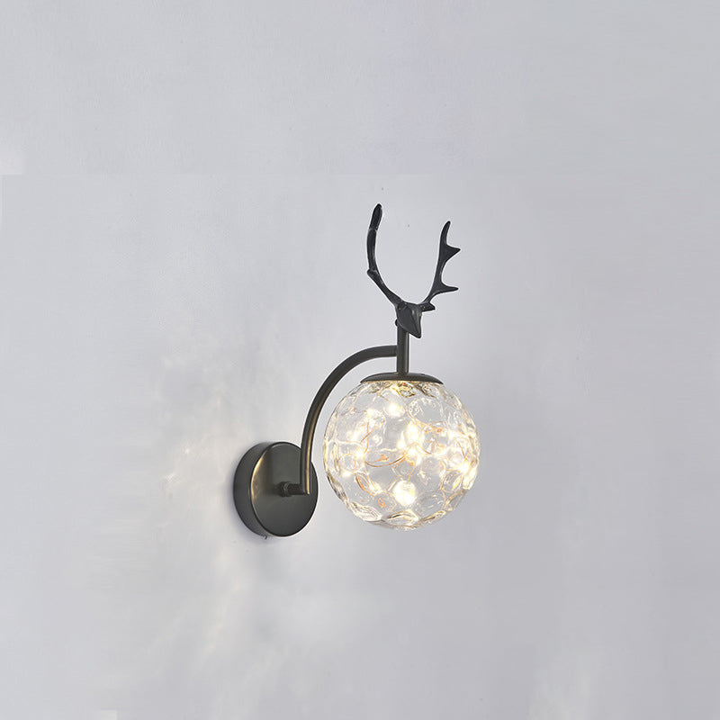 Glass Globe LED Wall Lamp in Modern Fashionable Wrought Iron Wall Sconce with Antler Decoration