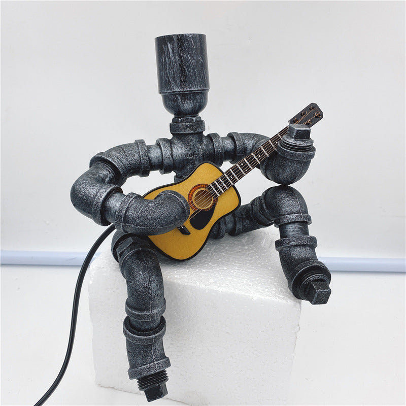 Lampada da comodino per piping creativa industriale a forma di chitarrista a forma di chitarrista per camera da letto per camera da letto