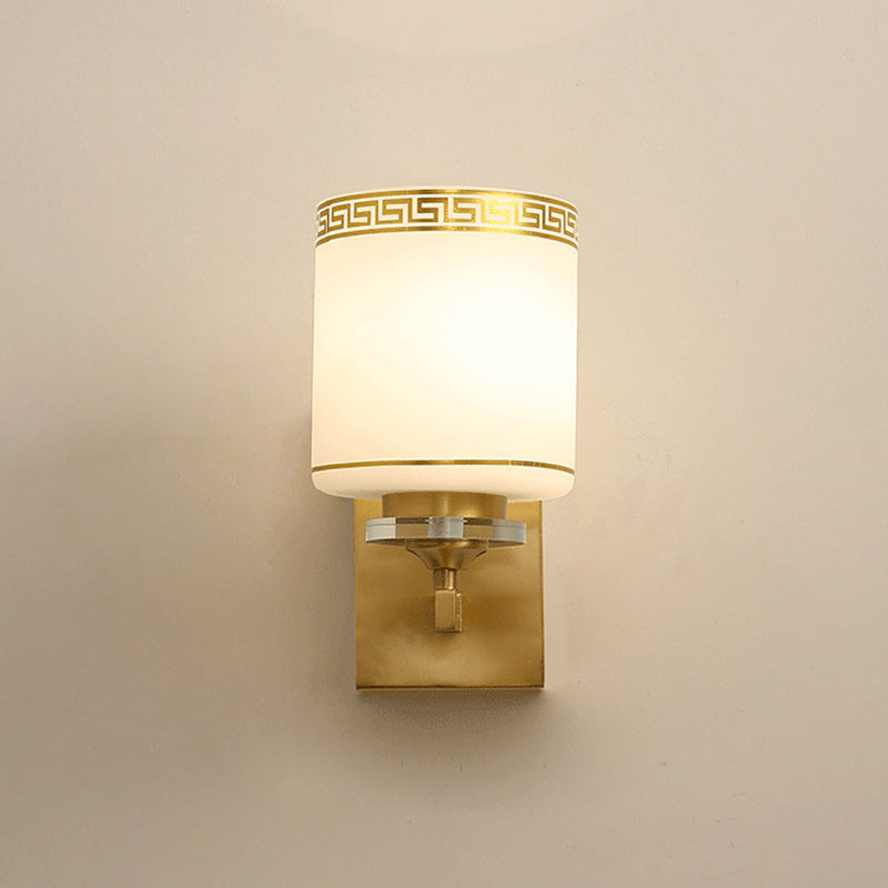 Single Cylinder Wall Light Sconce Traditional Opal Frosted Glass Wall Lamp in Gold with Swastika Element