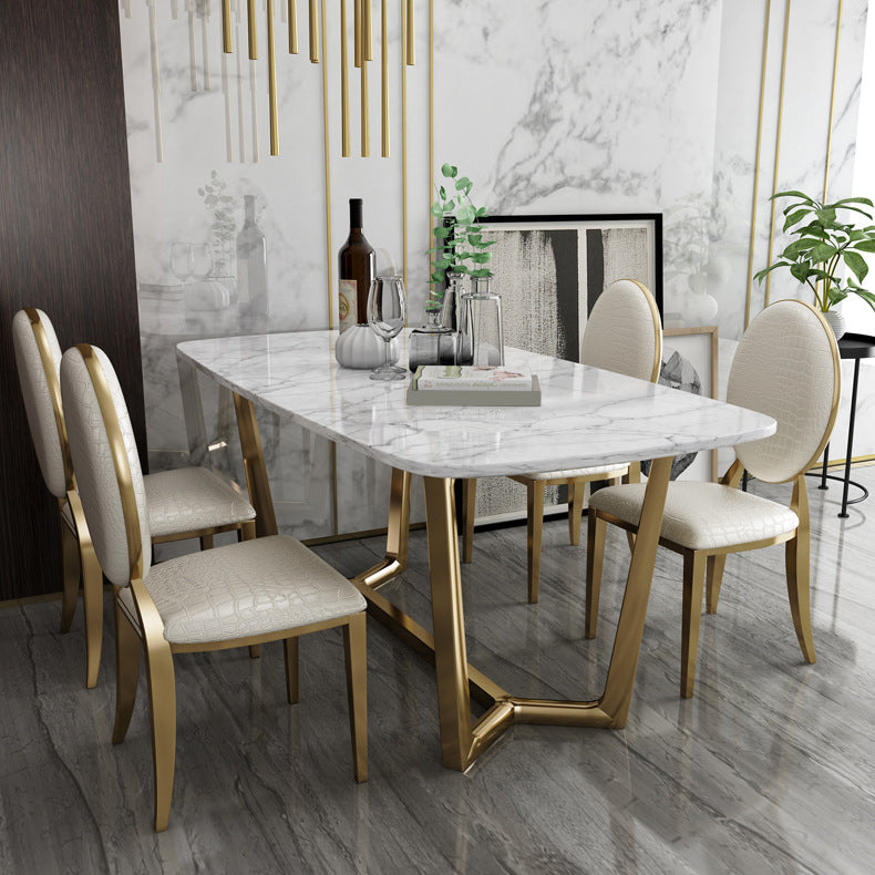 Juego de comedor de mármol de estilo moderno con mesa blanca y base de caballete de oro para uso en el hogar