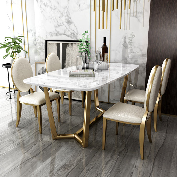 Juego de comedor de mármol de estilo moderno con mesa blanca y base de caballete de oro para uso en el hogar