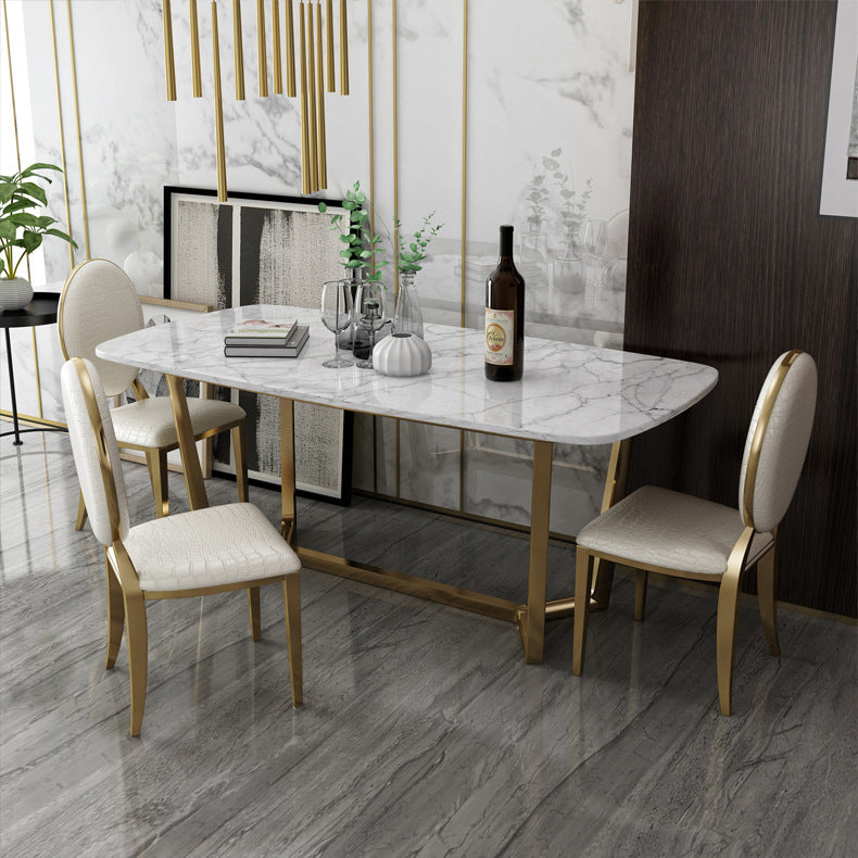 Juego de comedor de mármol de estilo moderno con mesa blanca y base de caballete de oro para uso en el hogar