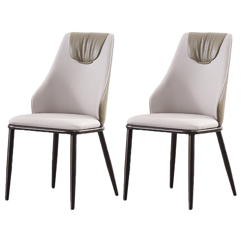 Moderne Metallflügelback -Stuhl -Leder -Essstühle mit schwarzen Beinen