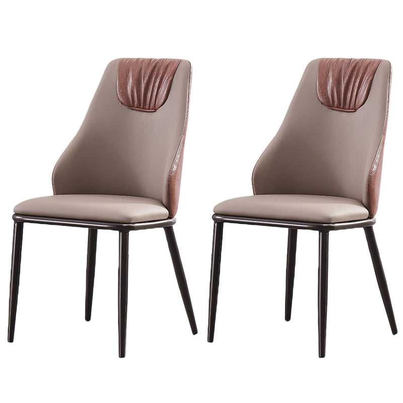 Moderne Metallflügelback -Stuhl -Leder -Essstühle mit schwarzen Beinen