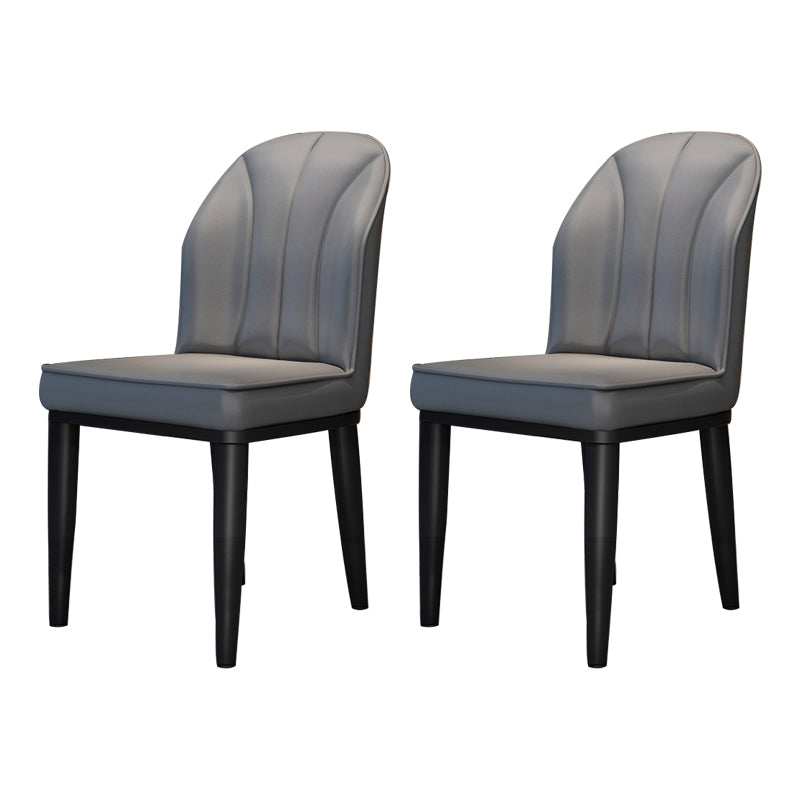 La salle à manger contemporaine en métal préside les chaises latérales à oreilles de finition métallique