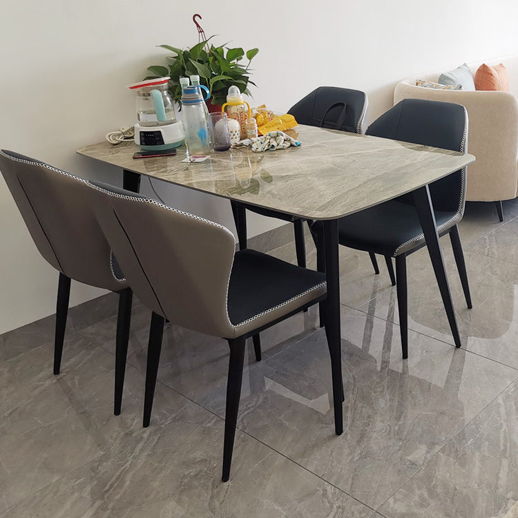 Juntos de comedor modernos con mesa de piedra sinterizada y sillas tapizadas