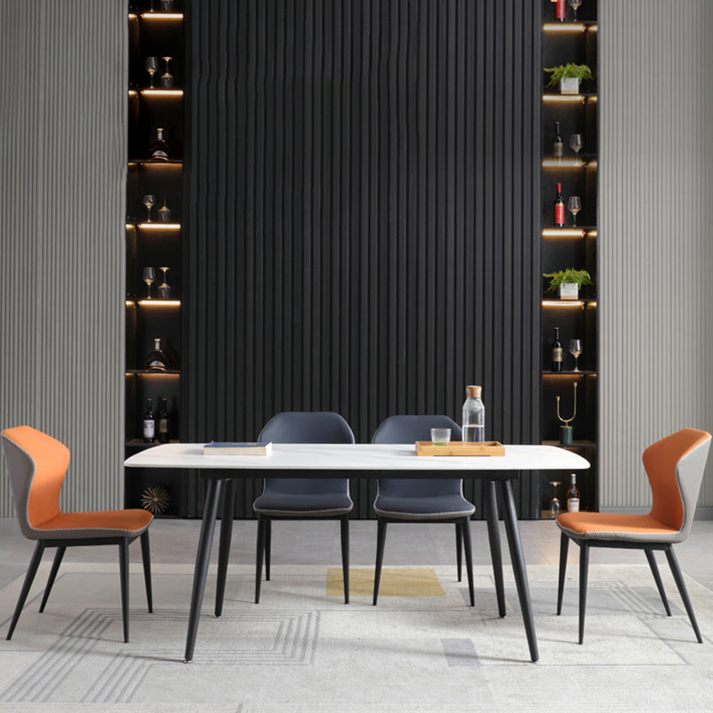 Table de table contemporaine avec table en pierre fritte et chaises rembourrées