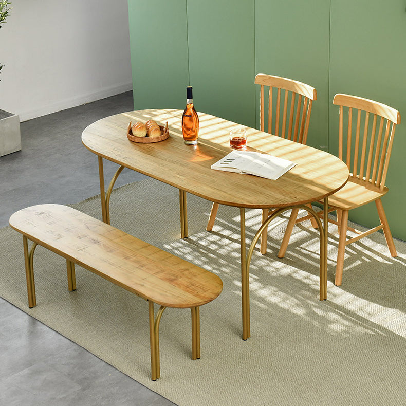 Zeitgenössischer Esstisch ovaler masser Holztisch mit metallischem vierbeinigen Tisch