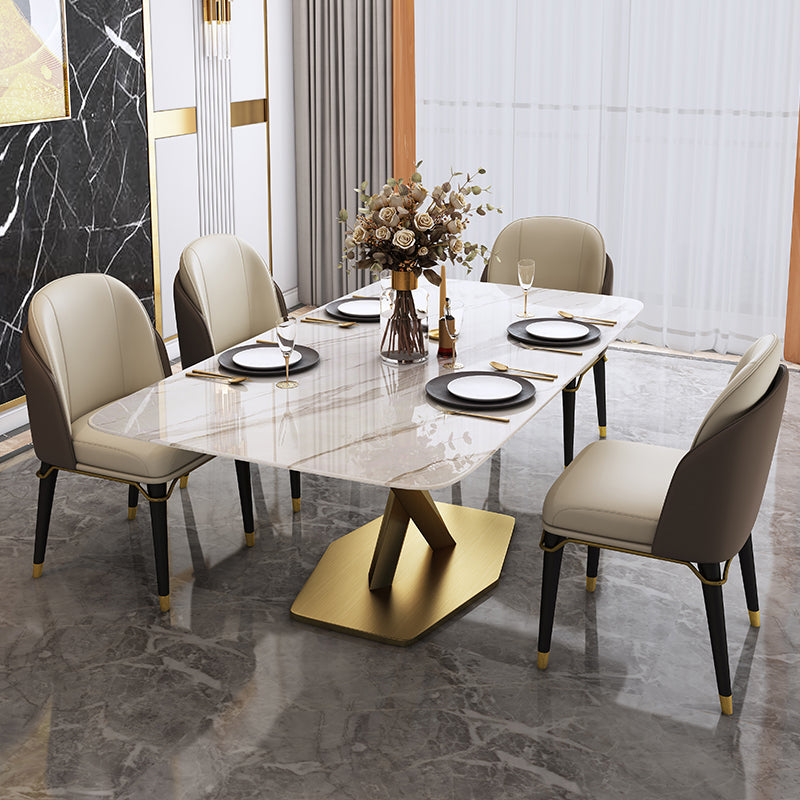 Mesa rectangular de piedra sinterizada con base de pedestal de metal dorado