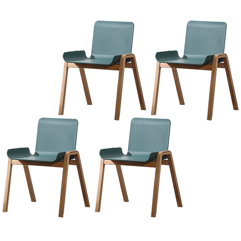 Sillón de comedor apilable escandinavo con respaldo macizo y patas de madera