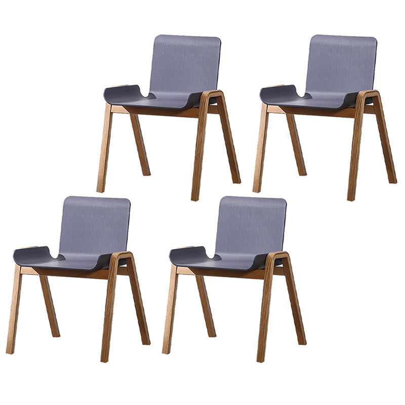 Sillón de comedor apilable escandinavo con respaldo macizo y patas de madera
