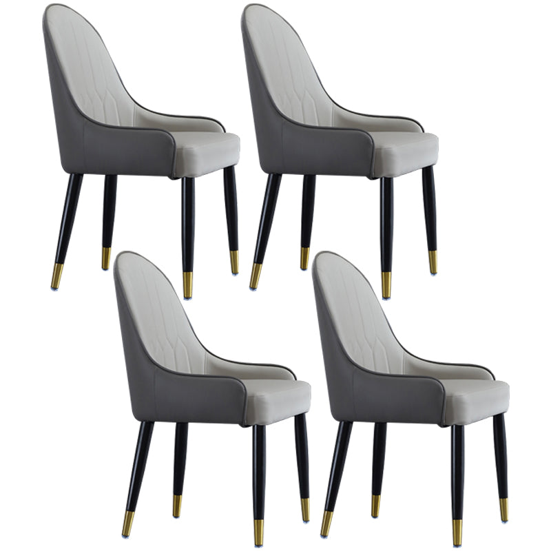 El comedor de madera contemporáneo preside los sillones laterales tapizados para el uso en el hogar