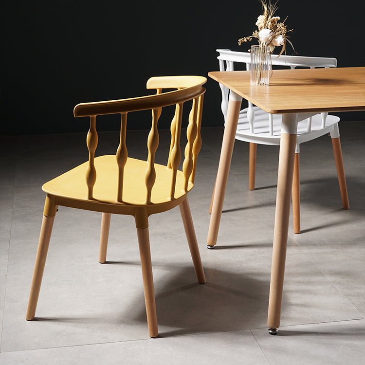 Sillas de comedor estilo moderno Sillas sin brazos de plástico con patas de madera