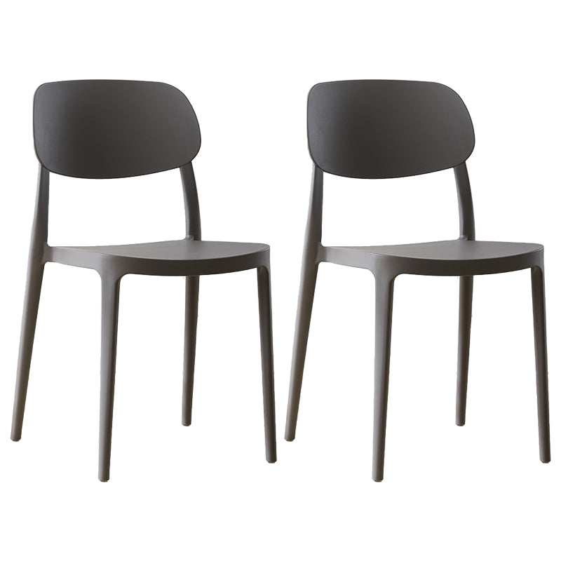 Silla lateral abierta apilable de cena sin brazos del plástico escandinavo de las sillas