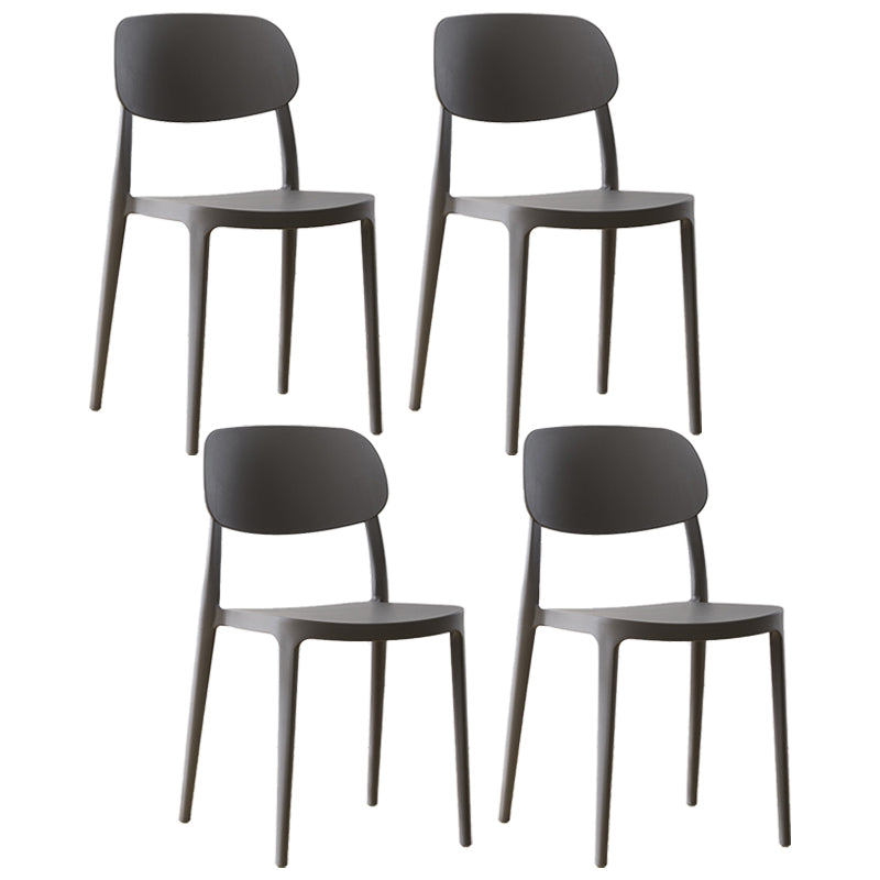 Silla lateral abierta apilable de cena sin brazos del plástico escandinavo de las sillas