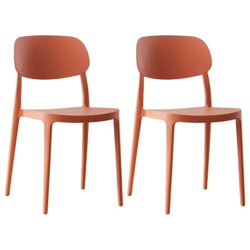 Silla lateral abierta apilable de cena sin brazos del plástico escandinavo de las sillas
