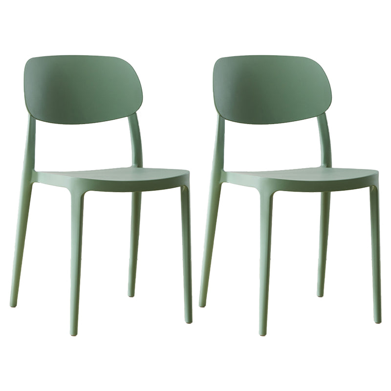 Silla lateral abierta apilable de cena sin brazos del plástico escandinavo de las sillas