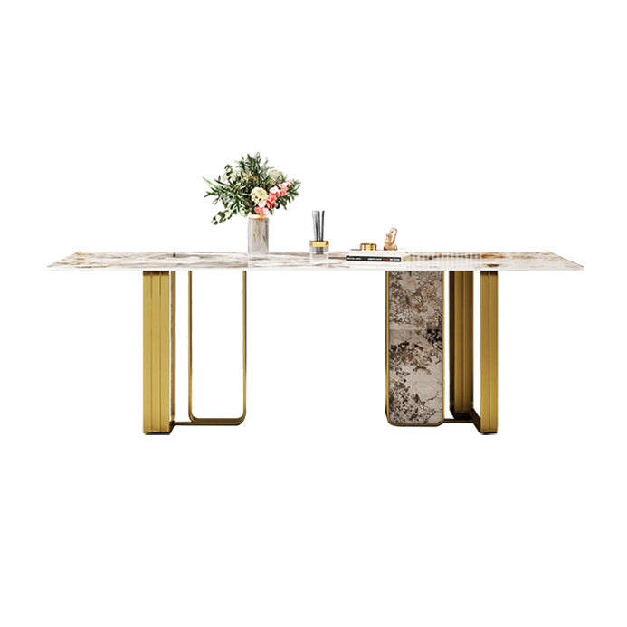 Mesa de comedor rectangular de piedra sinterizada de lujo con pedestal doble dorado