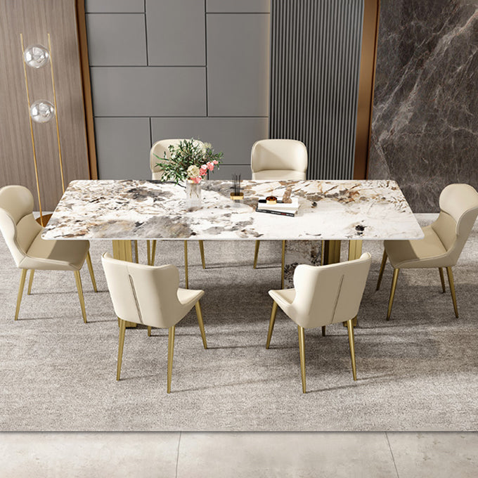 Mesa de comedor rectangular de piedra sinterizada de lujo con pedestal doble dorado