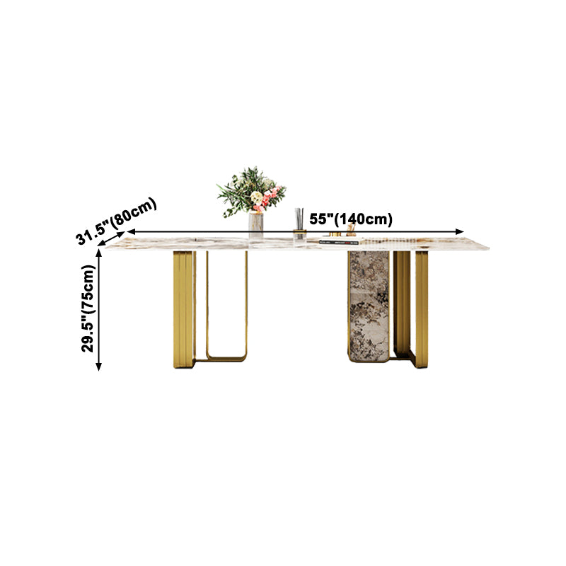 Mesa de comedor rectangular de piedra sinterizada de lujo con pedestal doble dorado