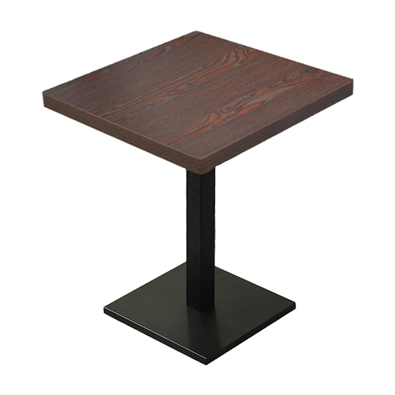 Mesa de comedor industrial de madera maciza con base de pedestal de metal