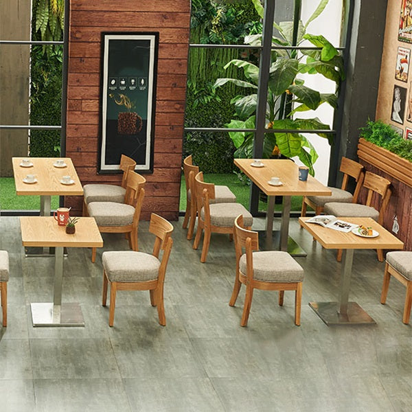 Mesa de comedor industrial de madera maciza con base de pedestal de metal