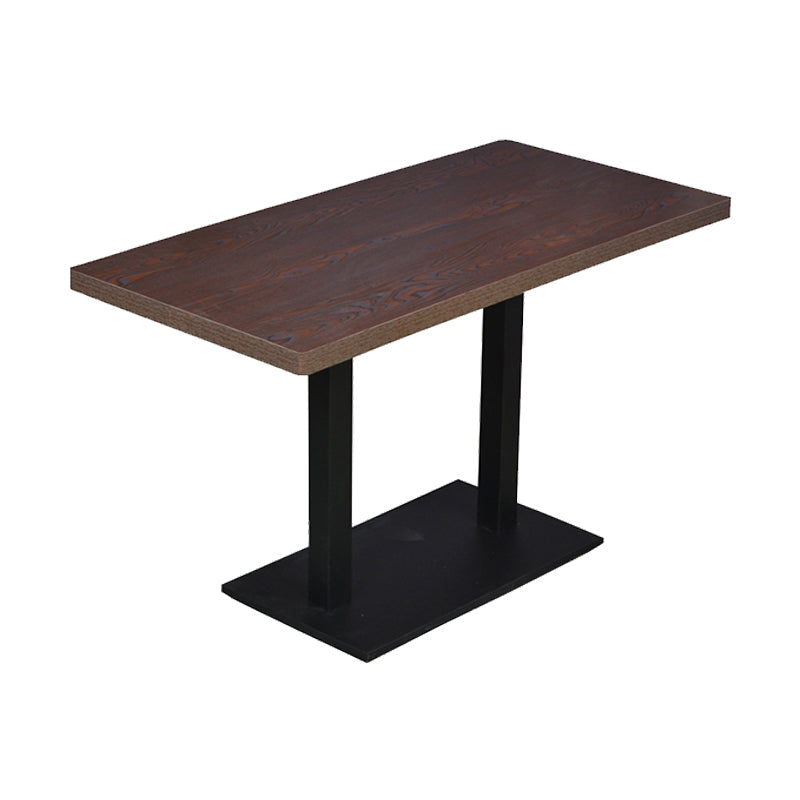 Mesa de comedor industrial de madera maciza con base de pedestal de metal