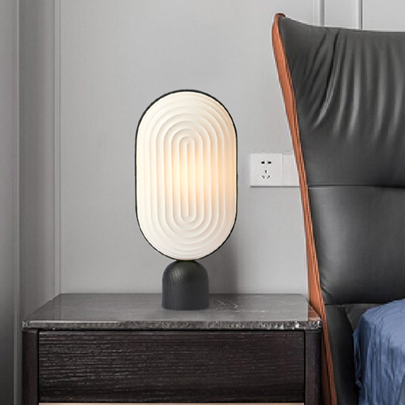 Zeitgenössische LED -Nachttischlampe Weiß längliches Lesebuch Licht mit Harzschatten
