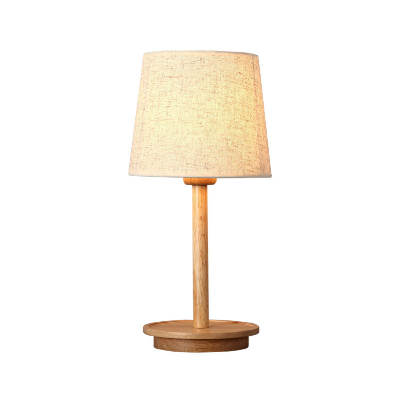 Lampada da comodino moderna affusolata in tessuto con 1 lampadina, colore bianco con base in legno