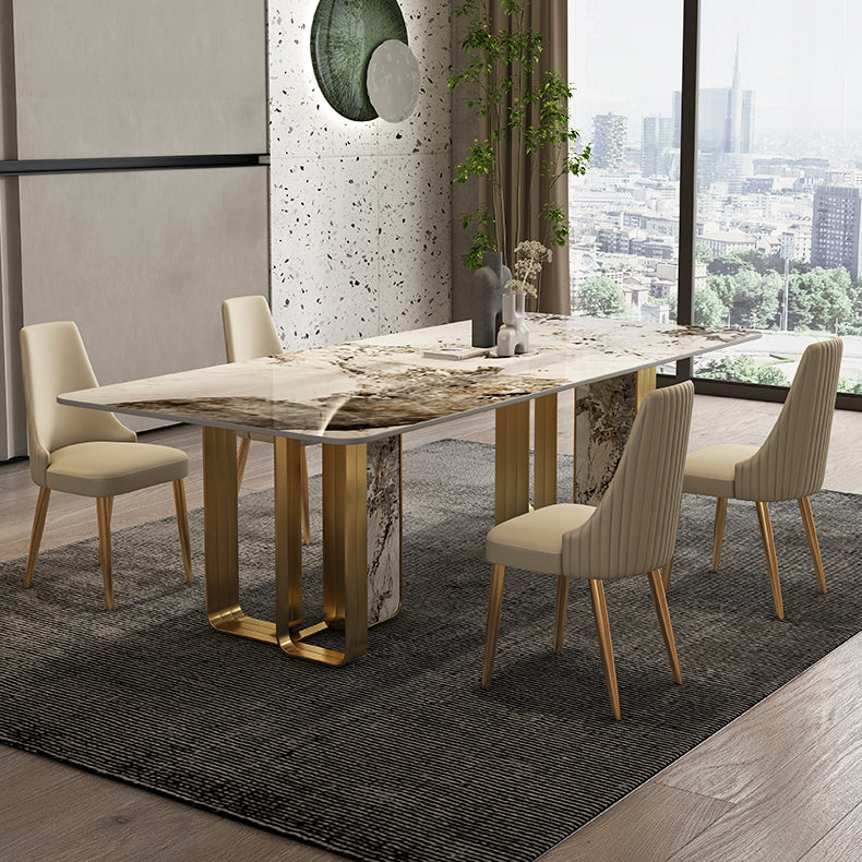 Mesa de comedor de piedra sinterizada de lujo con metal y piedra doble pedestal en oro