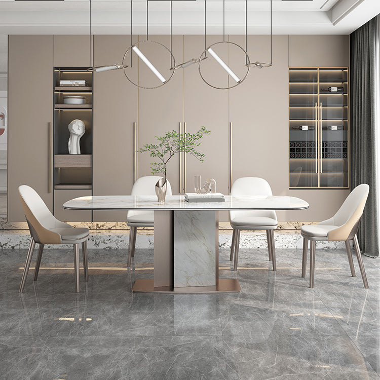 Mesa de comedor de piedra sinterizada de lujo con pedestal de metal en oro rosa