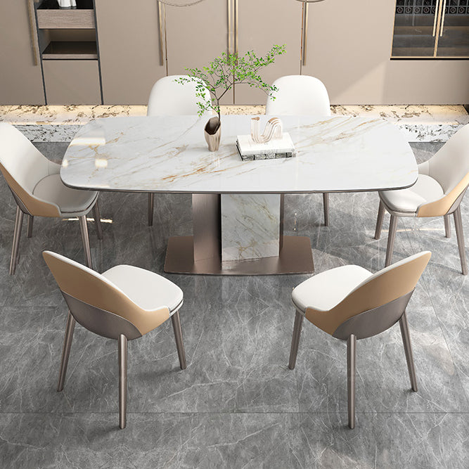 Mesa de comedor de piedra sinterizada de lujo con pedestal de metal en oro rosa