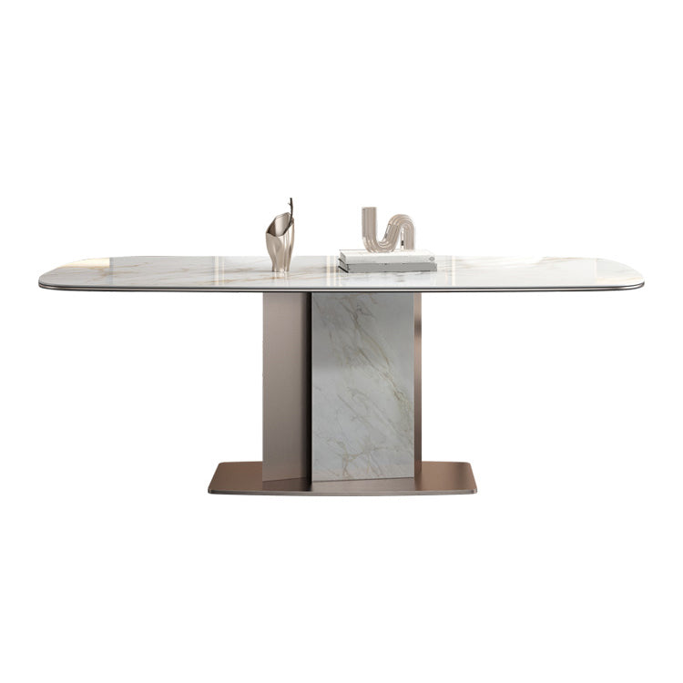 Mesa de comedor de piedra sinterizada de lujo con pedestal de metal en oro rosa