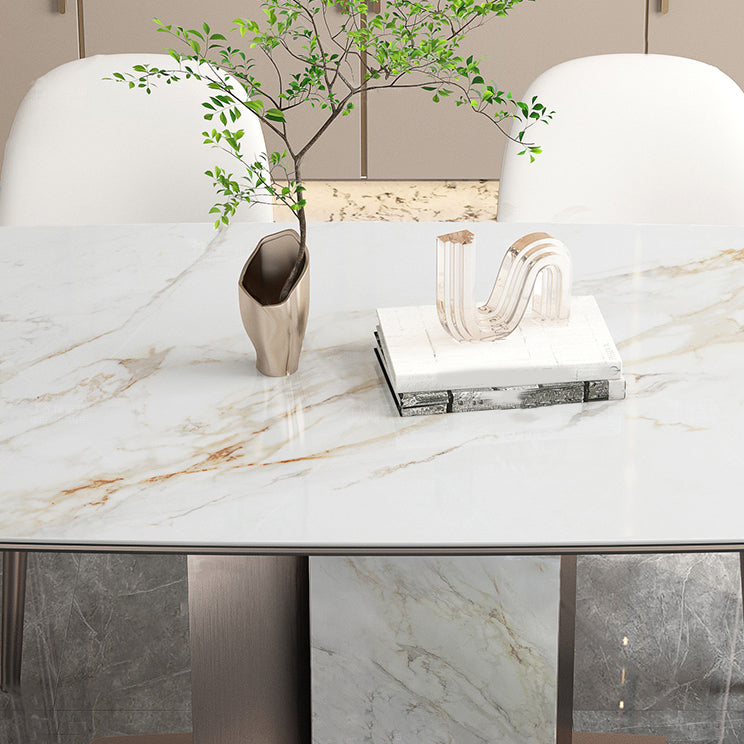 Mesa de comedor de piedra sinterizada de lujo con pedestal de metal en oro rosa