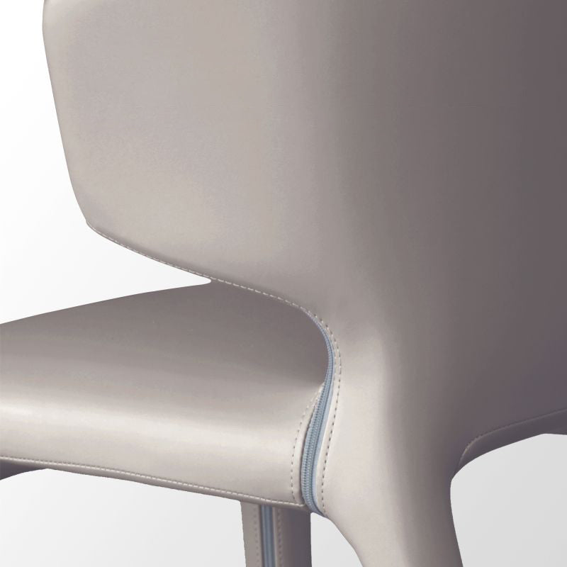 Silla de comedor individual con respaldo de ala y acabado mate de sillón de cuero estilo diseñador