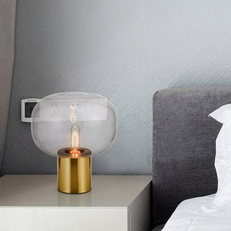 Lampada da comodino minimalista a 1 lampadina Illuminazione da tavolo ovale in metallo dorato con paralume in vetro grigio fumo