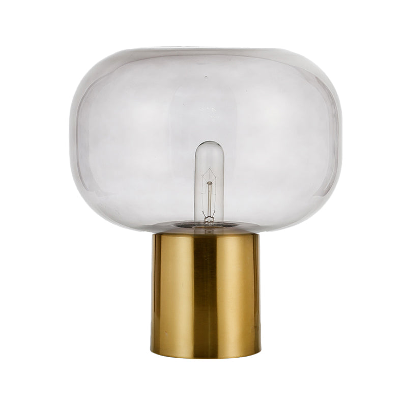 Lampada da comodino minimalista a 1 lampadina Illuminazione da tavolo ovale in metallo dorato con paralume in vetro grigio fumo